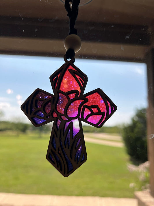 Tulip Cross Suncatcher with wood and acrylic, capturing light with rustic charm in sunlight.
