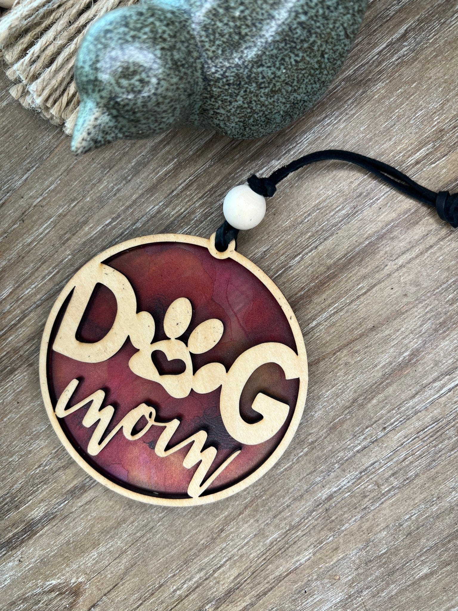Handmade Dog Mom suncatcher with natural wood and multicolor acrylic offering a rustic stained glass effect.