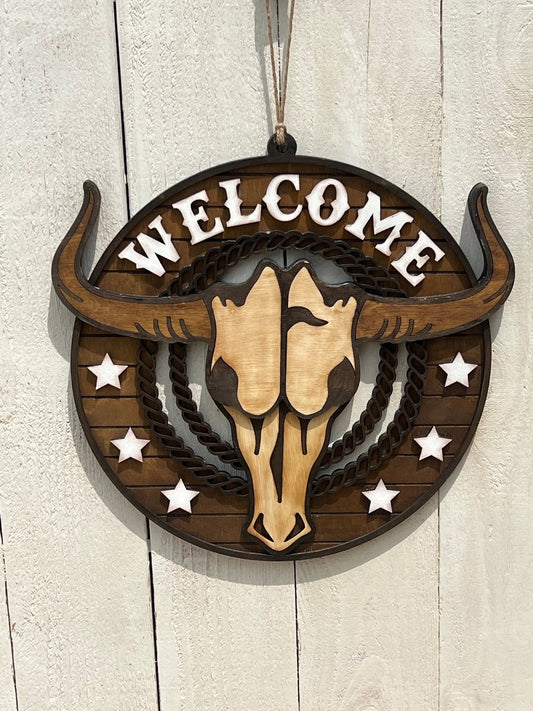 Rustic Longhorn Wood Door Hanger with natural wood texture and warm walnut stain on white fence.