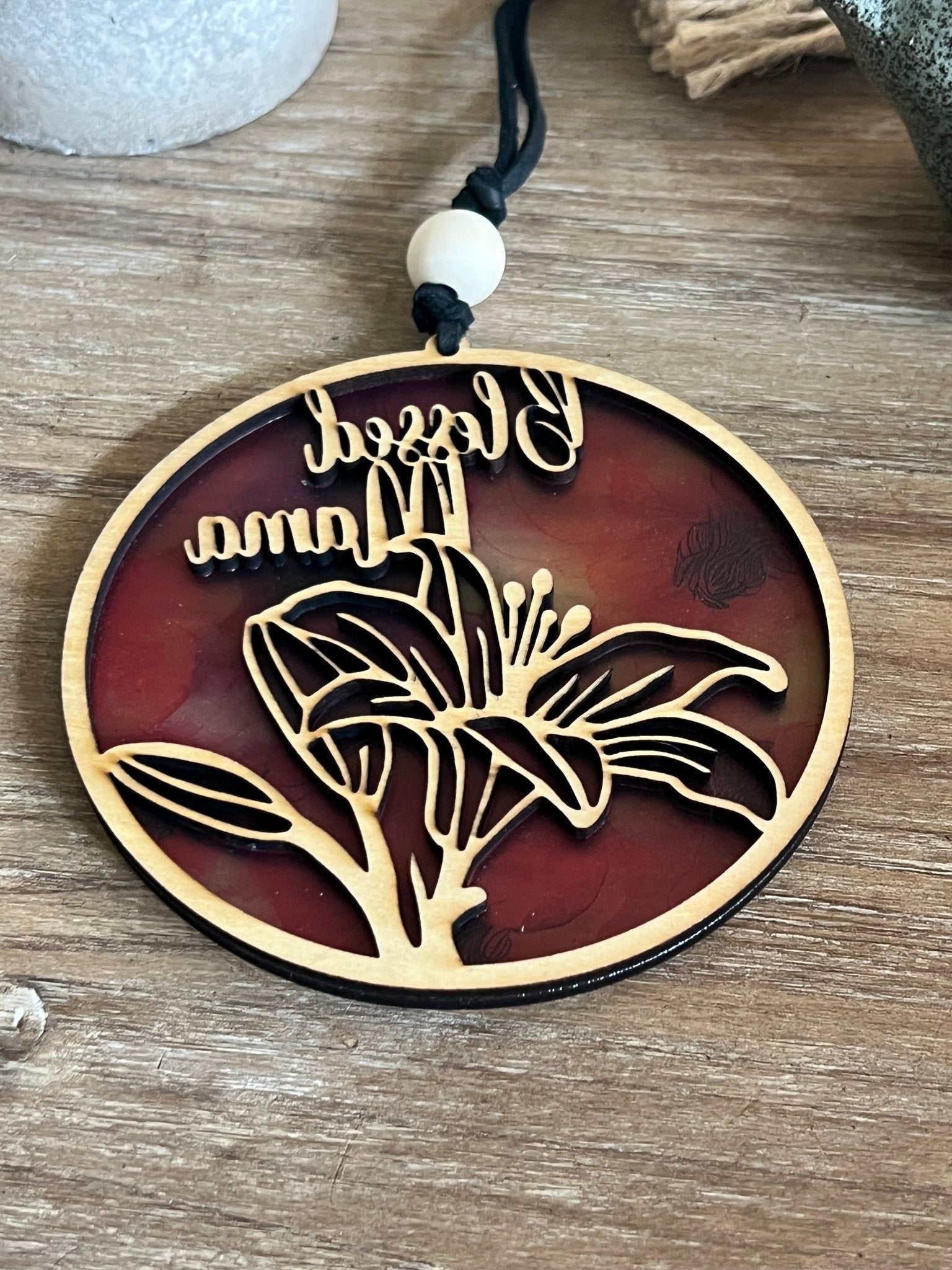 Handmade pink and coral Blessed Mama suncatcher with natural wood frame.