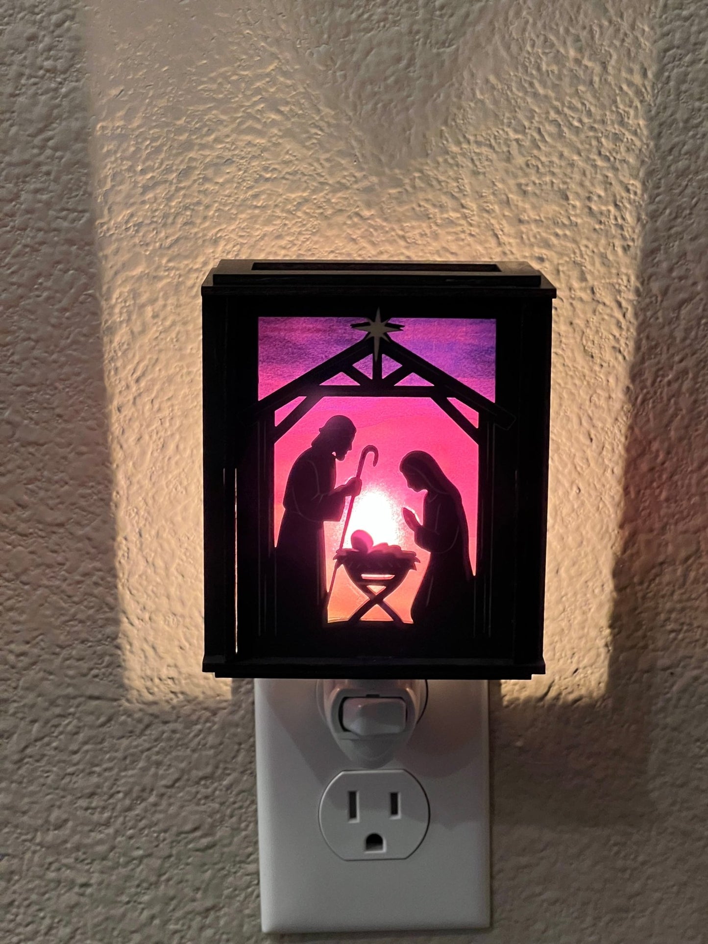 Black wood and multicolor acrylic Christmas Nativity Lantern Nightlight lit adn front view.