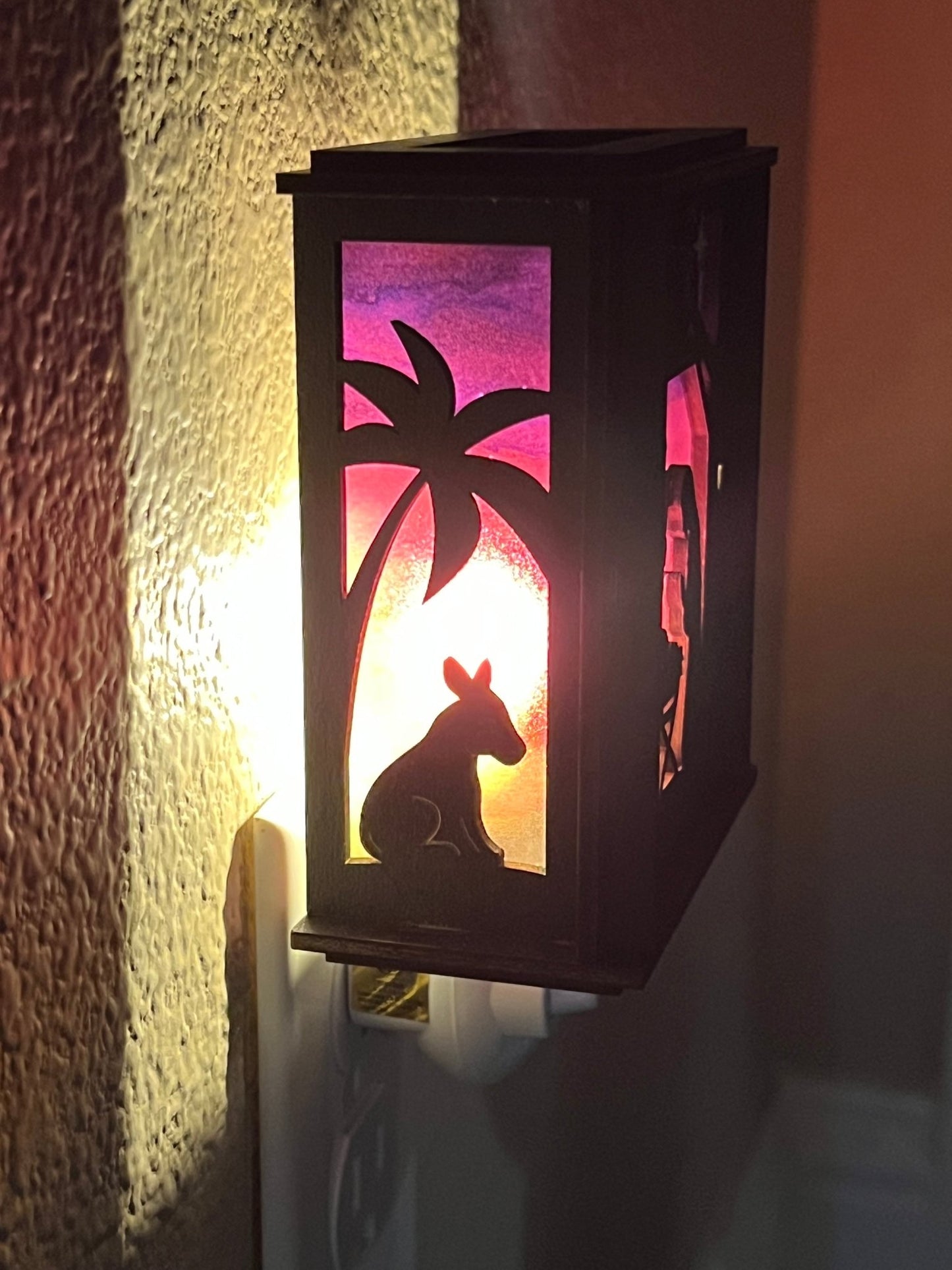 Black wood and multicolor acrylic Christmas Nativity Lantern Nightlight lit and left side view.