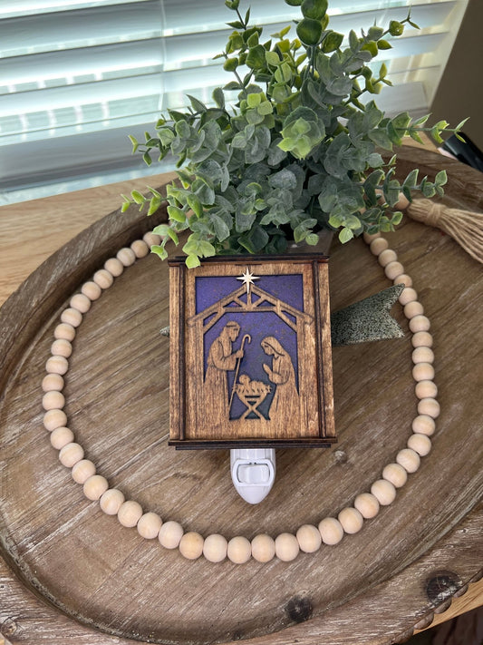 Golden oak stained wooden and acrylic nativity nightlight with rustic charm front view lying down and unlit.