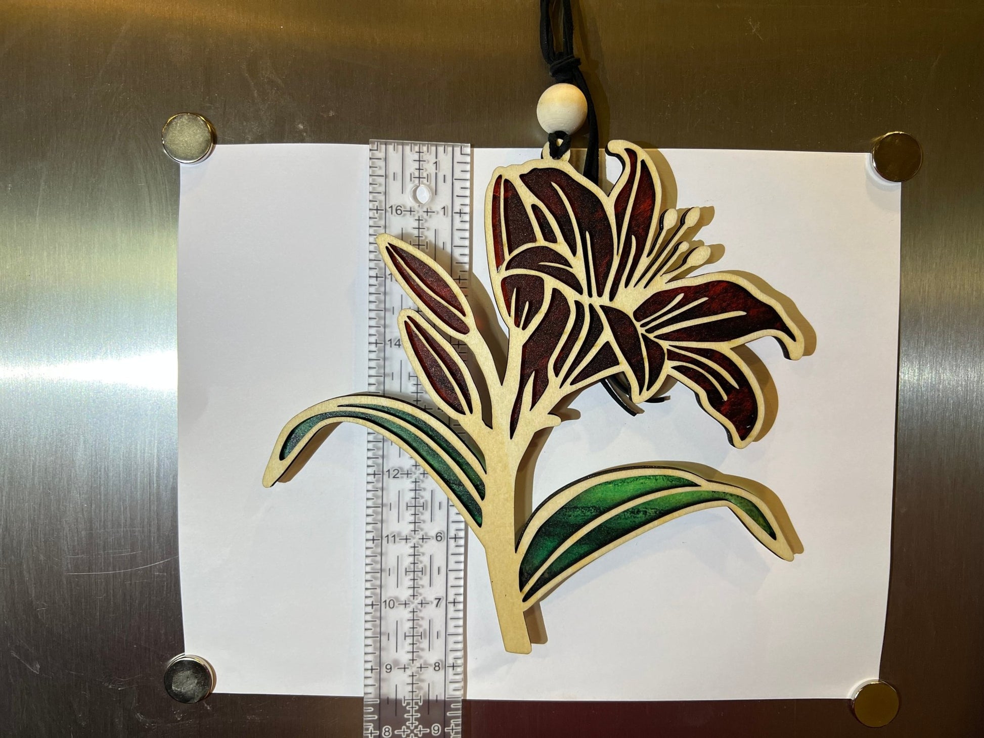 Red Daylily stained glass effect suncatcher with wood and acrylic materials, on white, perfect for rustic home decor.